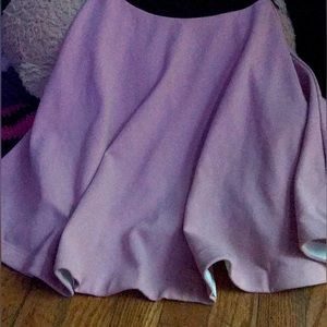 a pink pleated and black lace dress